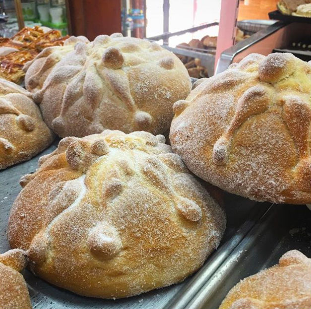 Day of the Dead loaves of bread displayed at a bakery
